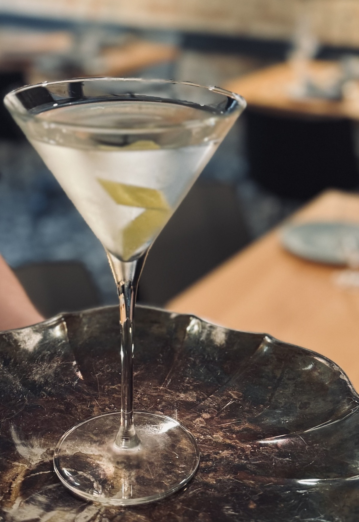a cocktail sitting on a serving tray